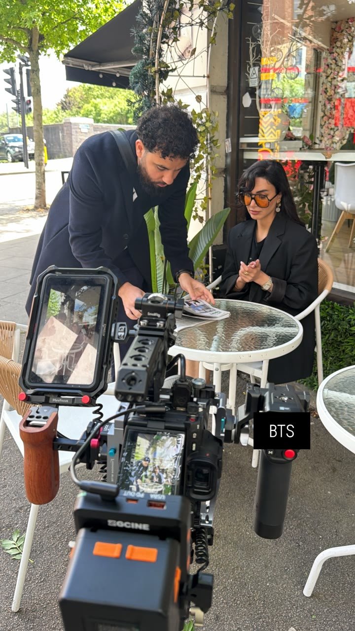 Melad directing Neda on location, camera rig in the foreground